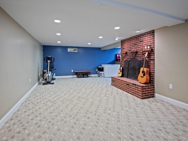 workout room featuring carpet floors, recessed lighting, baseboards, and a brick fireplace