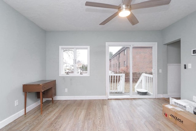 spare room with ceiling fan and light hardwood / wood-style floors