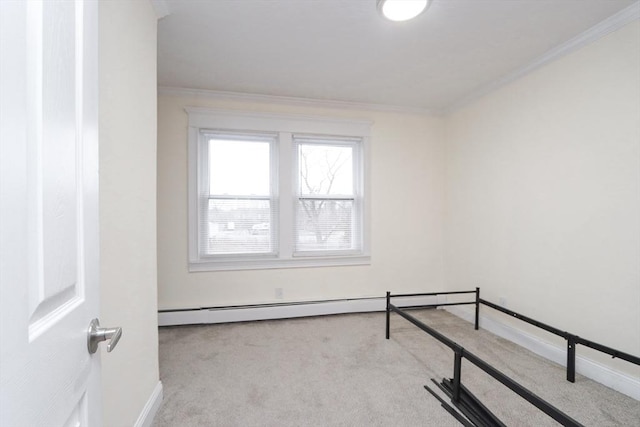 bedroom with light colored carpet, baseboard heating, and ornamental molding