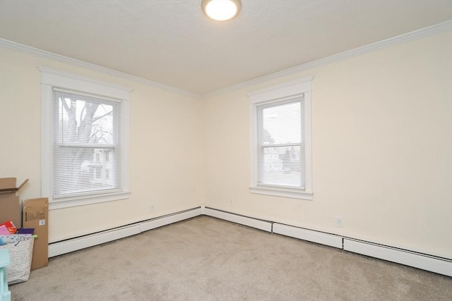 spare room featuring a healthy amount of sunlight, ornamental molding, and light carpet