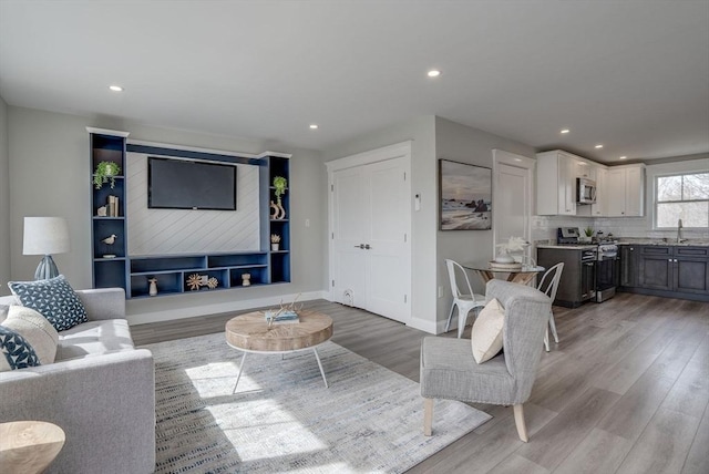 138 Flash Rd Unit 1, Nahant, MA 01908 - living area featuring light wood-style floors and recessed lighting