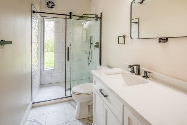 212 Charles Neck Way, West Tisbury, MA 02575 - full bath with toilet, a stall shower, vanity, and marble look tiles