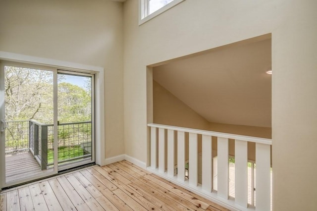 212 Charles Neck Way, West Tisbury, MA 02575 - doorway featuring wood-type flooring, a high ceiling, and baseboards