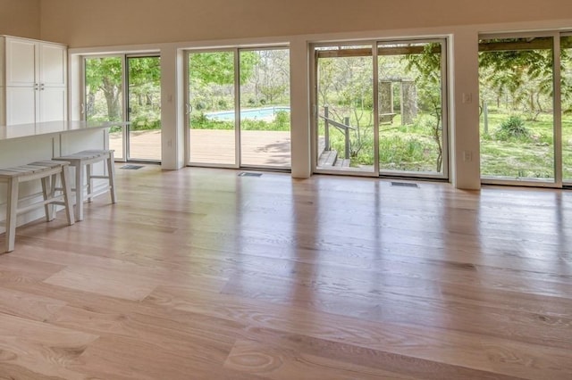 212 Charles Neck Way, West Tisbury, MA 02575 - unfurnished living room with plenty of natural light and light wood-type flooring