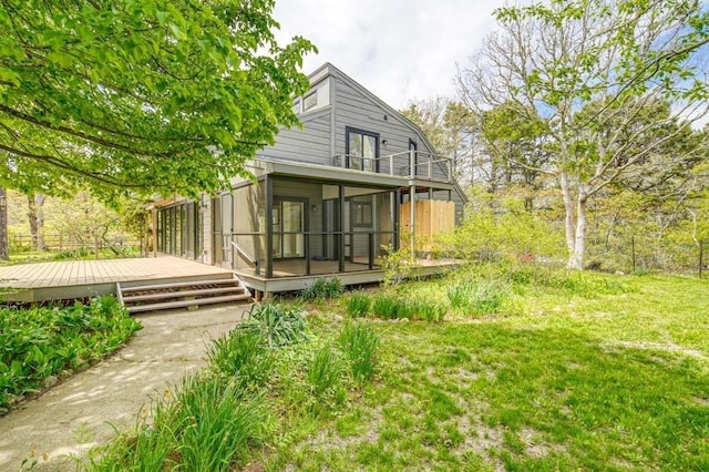 212 Charles Neck Way, West Tisbury, MA 02575 - back of property featuring a deck, a sunroom, and a balcony