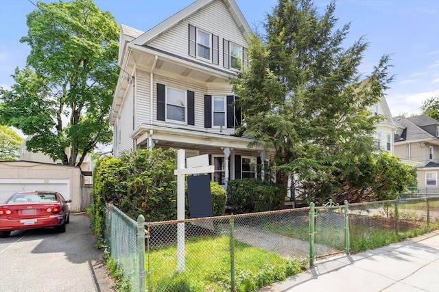 view of front of home with a garage and asphalt driveway