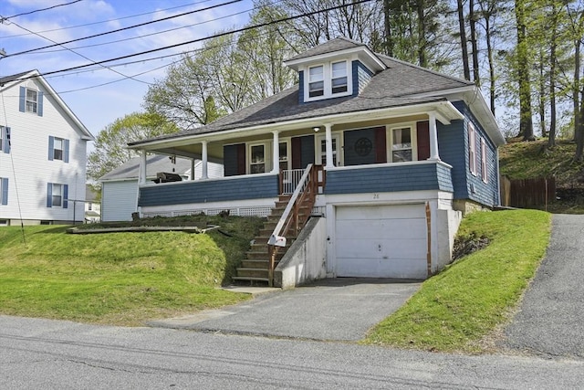 28 Upton St, Adams, MA 01220 - view of front of home with driveway, a garage, stairs, a porch, and a front lawn