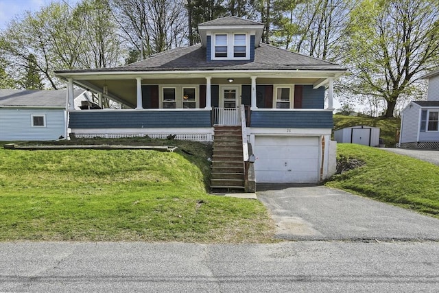 28 Upton St, Adams, MA 01220 - view of front facade featuring a front yard, stairway, covered porch, and a storage unit