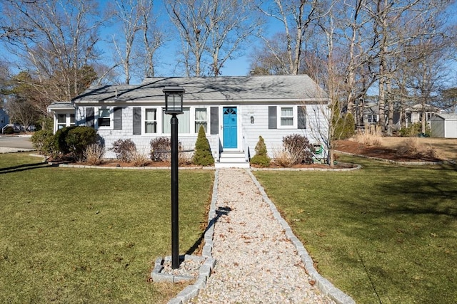 single story home with entry steps and a front yard