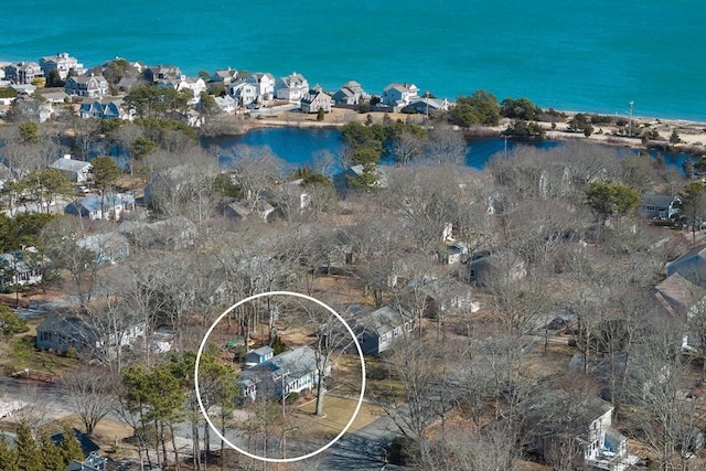 drone / aerial view featuring a water view and a residential view