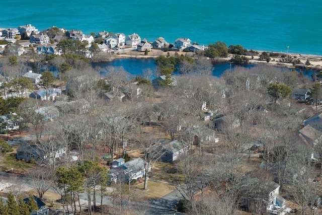 drone / aerial view featuring a residential view and a water view