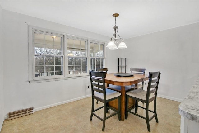 dining room with an inviting chandelier