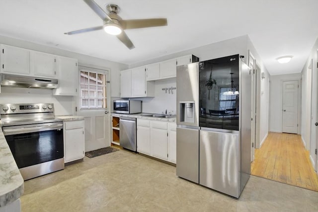 kitchen featuring ceiling fan, sink, white cabinets, and appliances with stainless steel finishes