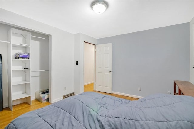 bedroom with hardwood / wood-style flooring