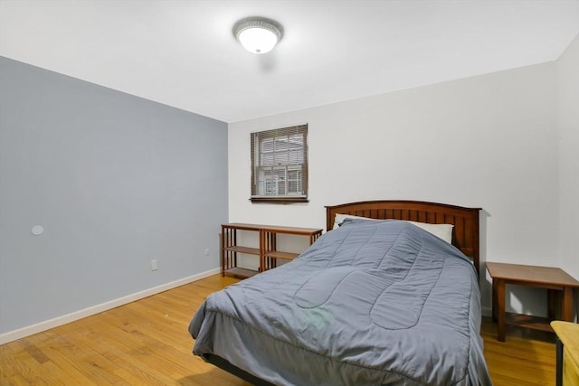 bedroom featuring wood-type flooring