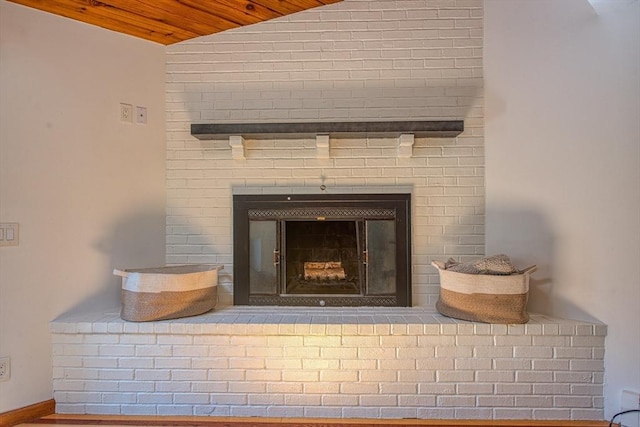 details with a brick fireplace and wood ceiling