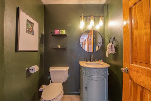 half bathroom featuring vanity and toilet