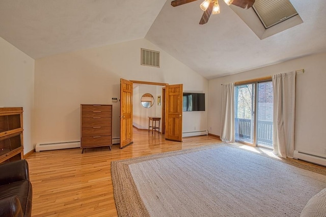 interior space with visible vents, access to outside, light wood-style floors, and baseboard heating
