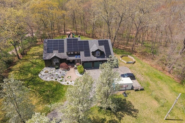 birds eye view of property with a wooded view