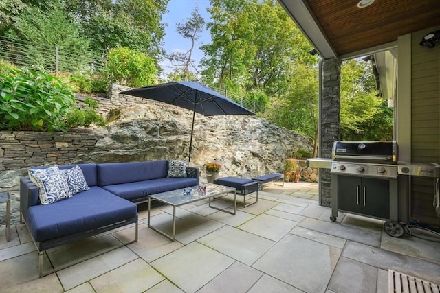 view of patio featuring an outdoor hangout area, grilling area, and fence