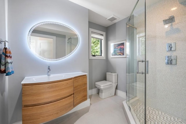 bathroom featuring toilet, visible vents, vanity, baseboards, and a stall shower