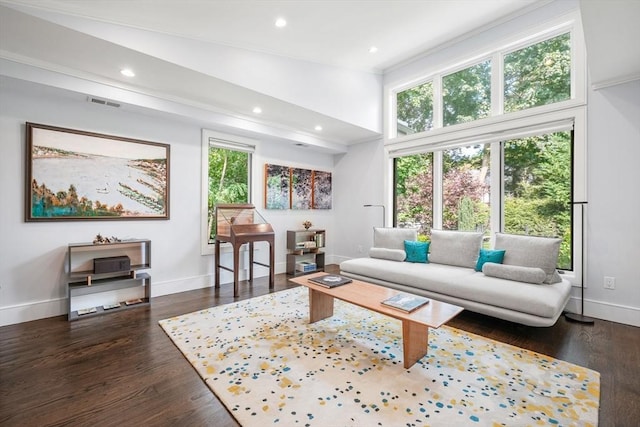 living room featuring baseboards, visible vents, dark wood finished floors, and recessed lighting