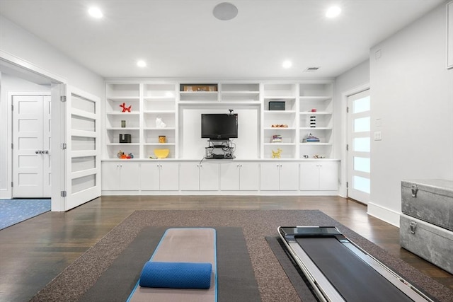 workout room with baseboards, dark wood finished floors, visible vents, and recessed lighting