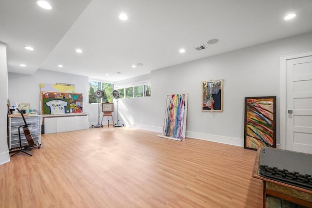 interior space with baseboards, light wood-style flooring, visible vents, and recessed lighting