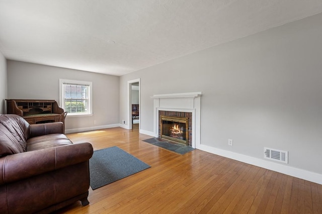 2 Proctor Cir, Peabody, MA 01960 - living room with light wood finished floors and a fireplace