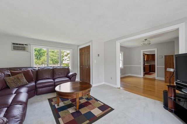 2 Proctor Cir, Peabody, MA 01960 - living room with carpet flooring and a wall unit AC