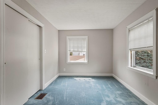 2 Proctor Cir, Peabody, MA 01960 - unfurnished bedroom featuring carpet flooring and multiple windows