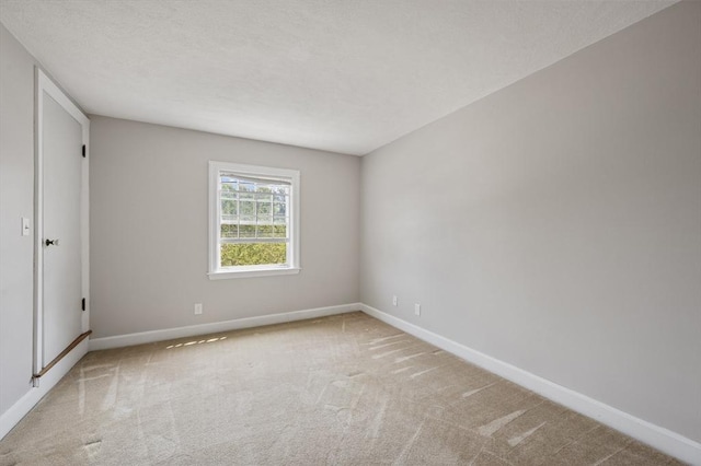 2 Proctor Cir, Peabody, MA 01960 - carpeted empty room featuring baseboards and a textured ceiling