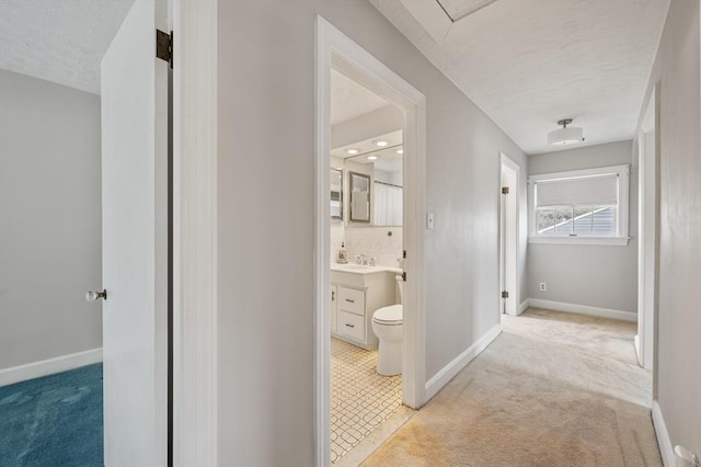2 Proctor Cir, Peabody, MA 01960 - hallway featuring light carpet and baseboards