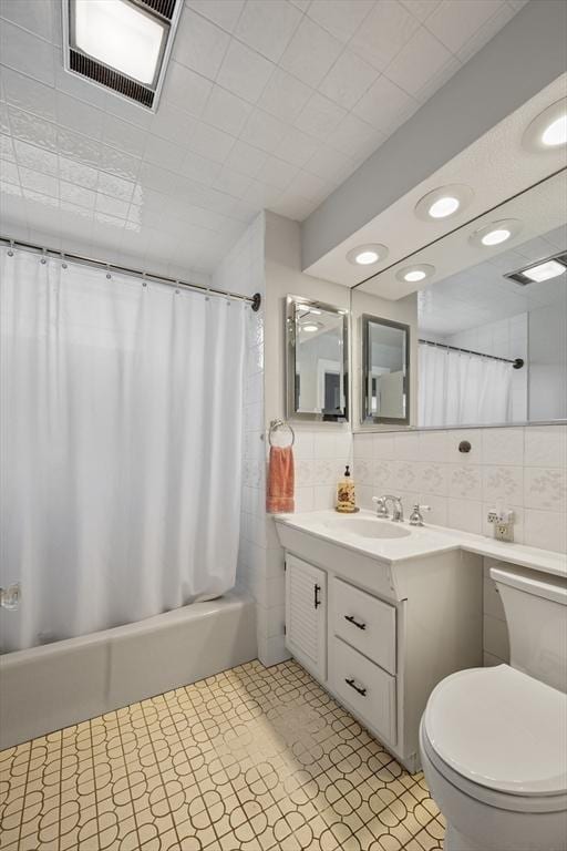 2 Proctor Cir, Peabody, MA 01960 - full bath featuring vanity, shower / tub combo, tile walls, tile patterned floors, and backsplash