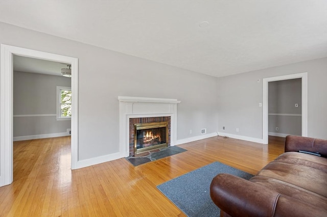 2 Proctor Cir, Peabody, MA 01960 - living area with wood finished floors and a fireplace