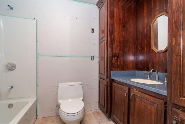 bathroom with vanity, a bathtub, wooden walls, and toilet