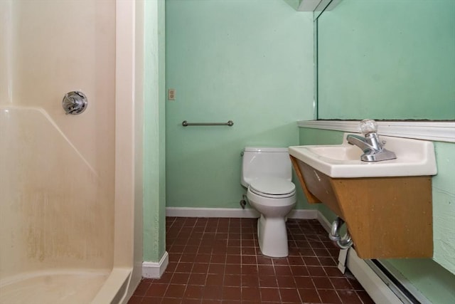 bathroom featuring walk in shower, vanity, and toilet