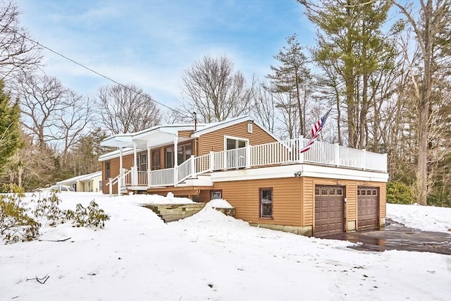 view of front of house featuring a garage and a porch