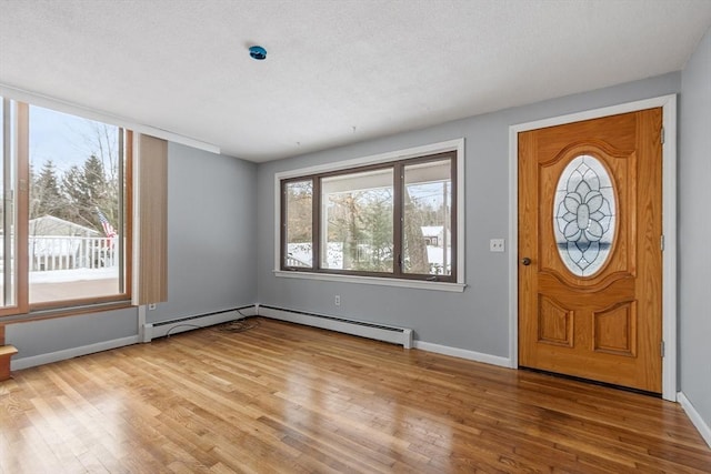 entryway featuring light wood-type flooring and baseboards