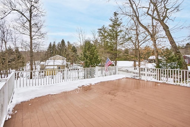 view of snow covered deck