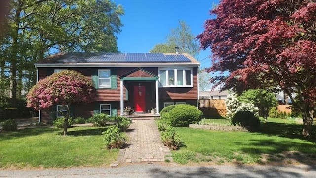 288 Norman St, Fall River, MA 02721 - bi-level home with solar panels and a front lawn