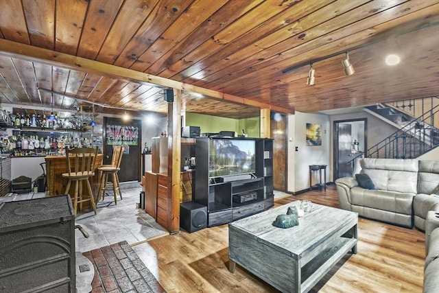 288 Norman St, Fall River, MA 02721 - living room with a dry bar, stairway, wood finished floors, and baseboards