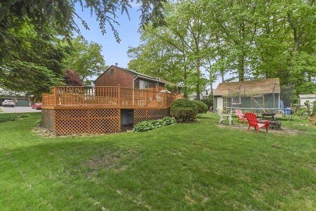 288 Norman St, Fall River, MA 02721 - view of grassy yard featuring a deck and a trampoline