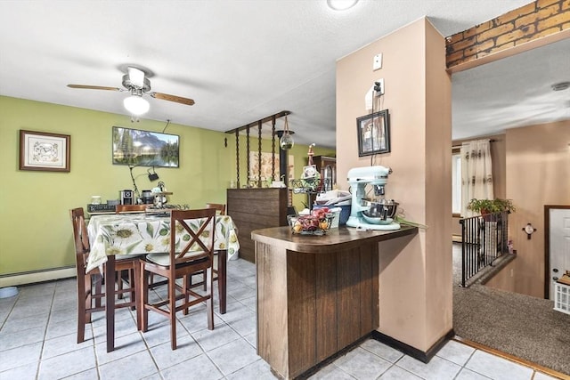 288 Norman St, Fall River, MA 02721 - bar with a ceiling fan, tile patterned flooring, and a baseboard heating unit