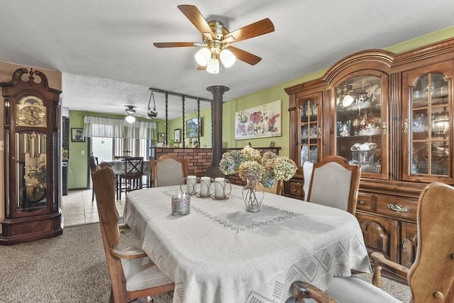 288 Norman St, Fall River, MA 02721 - carpeted dining room featuring a ceiling fan and a wood stove