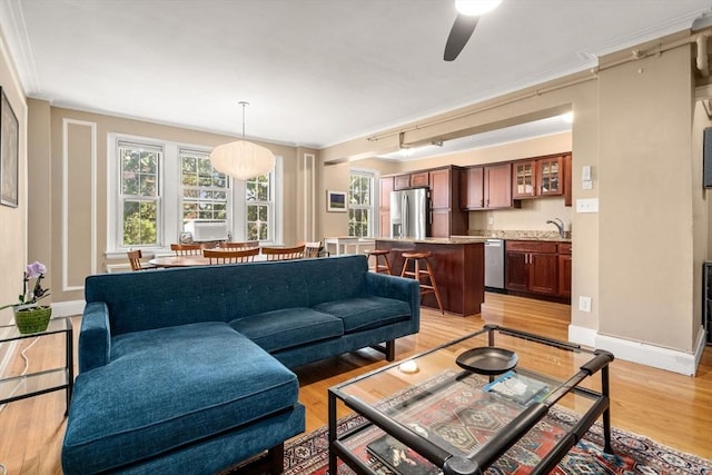 1450-1454 Beacon St Unit 301, Brookline, MA 02446 - living room with light wood-type flooring, ceiling fan, and crown molding