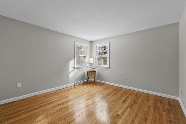 unfurnished room featuring light hardwood / wood-style floors