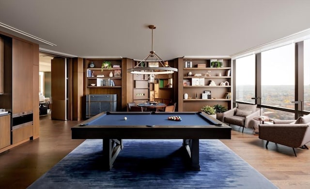 game room featuring a wall of windows, pool table, and wood finished floors