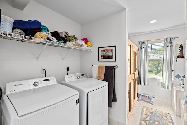 clothes washing area with separate washer and dryer