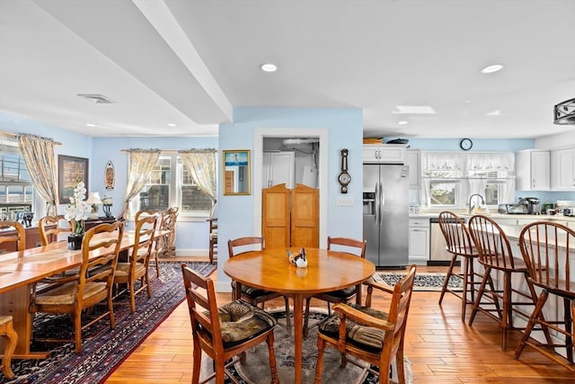 dining room featuring light hardwood / wood-style floors and sink